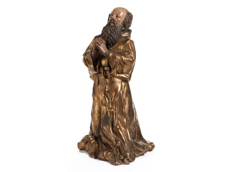 Seltene farbige und gold gefasste Tonfigur eines knienden Heiligen